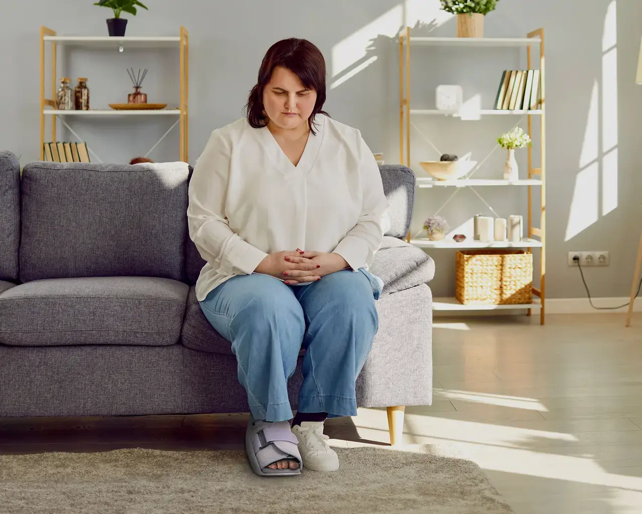 Woman on couch in pain; I stopped going shopping.